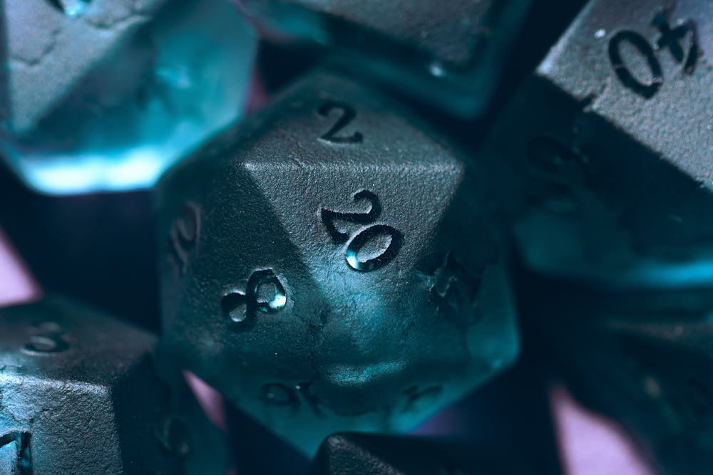 a close up of a metal dice with numbers on it