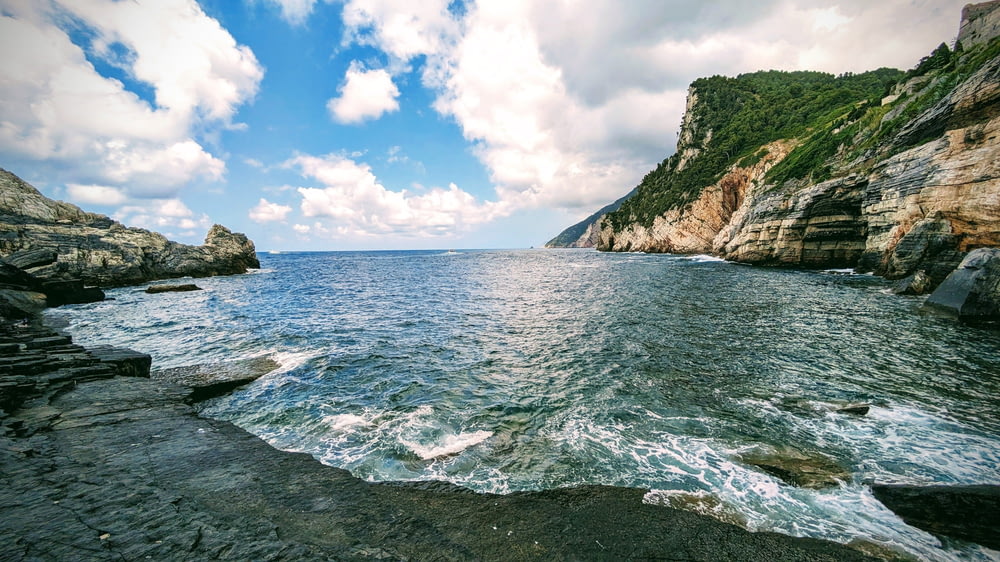 a body of water surrounded by rocky cliffs