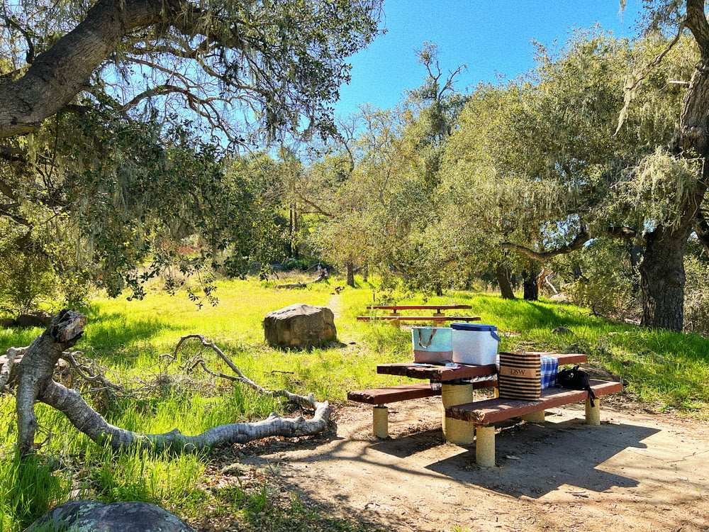 a picnic table in the middle of a field