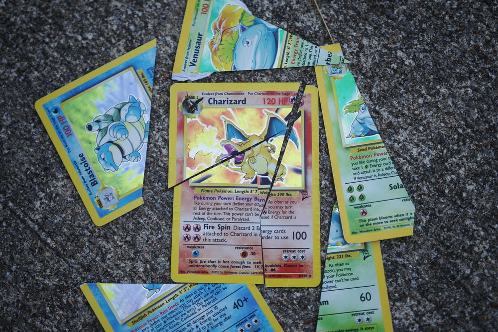 a bunch of pokemon cards laying on the ground