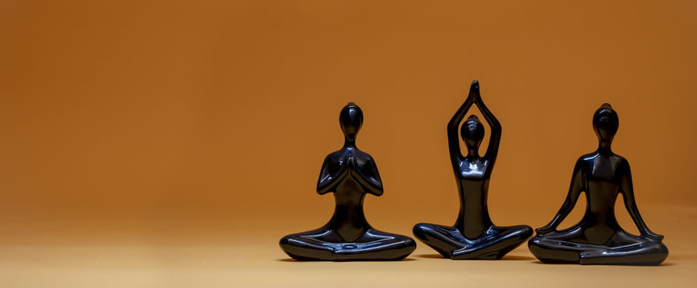 a group of three statues sitting next to each other