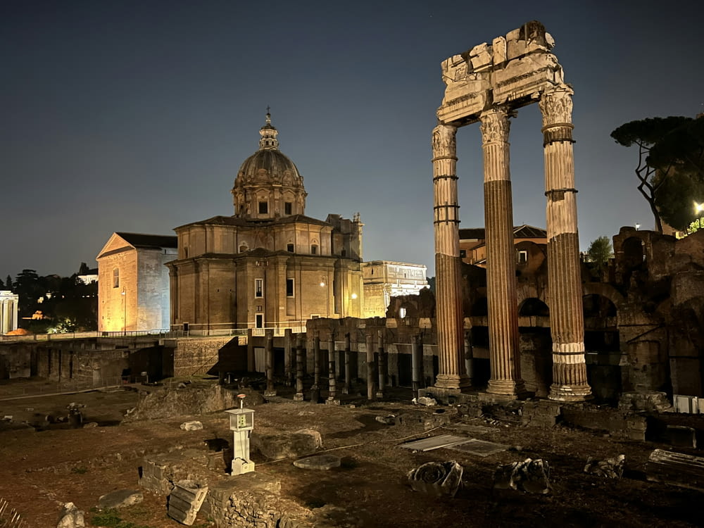 the ruins of a roman city at night