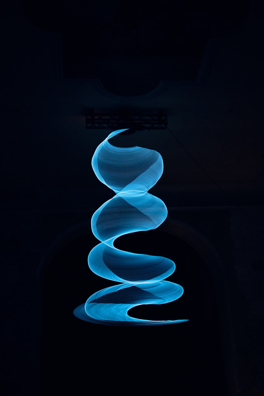 a black background with a blue spiral design