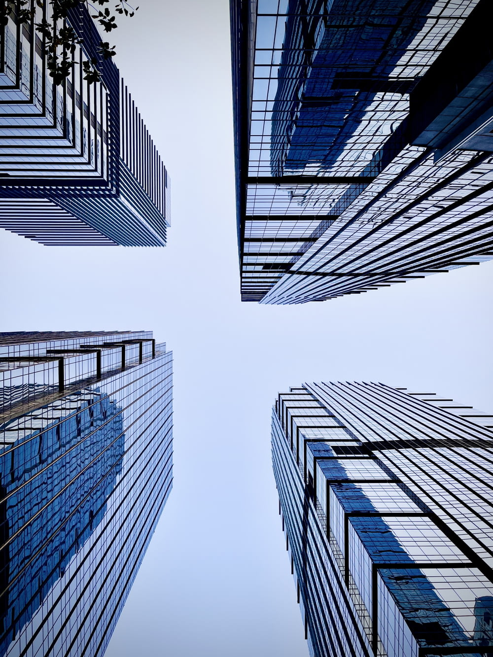 a group of tall buildings with a sky background