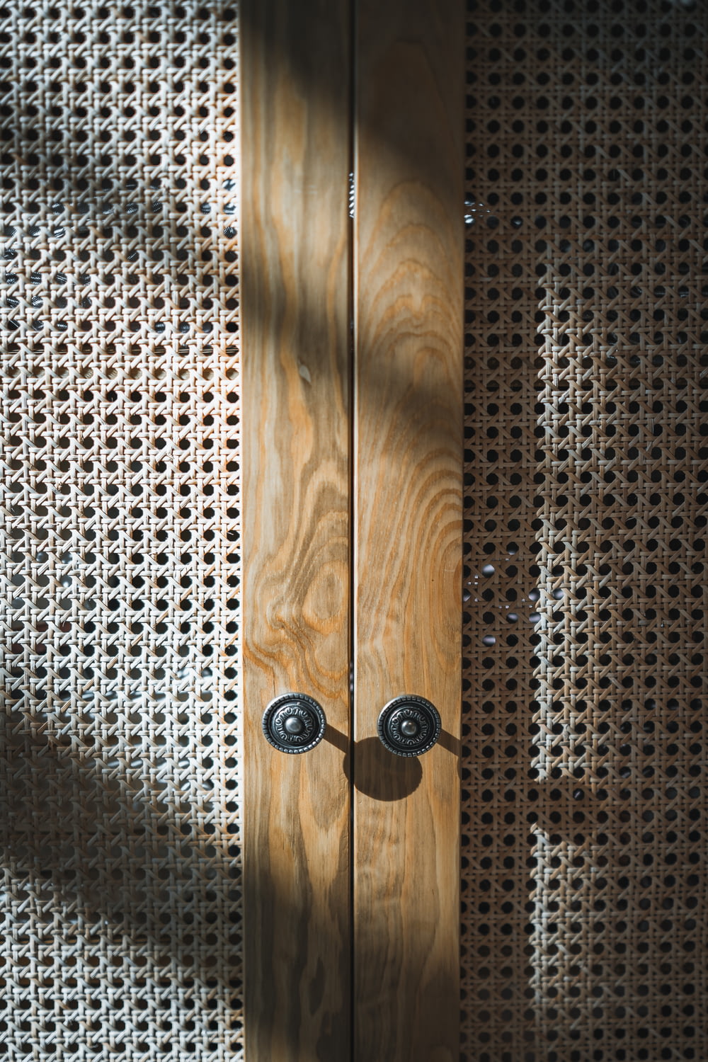 a wooden door with two knobs on it