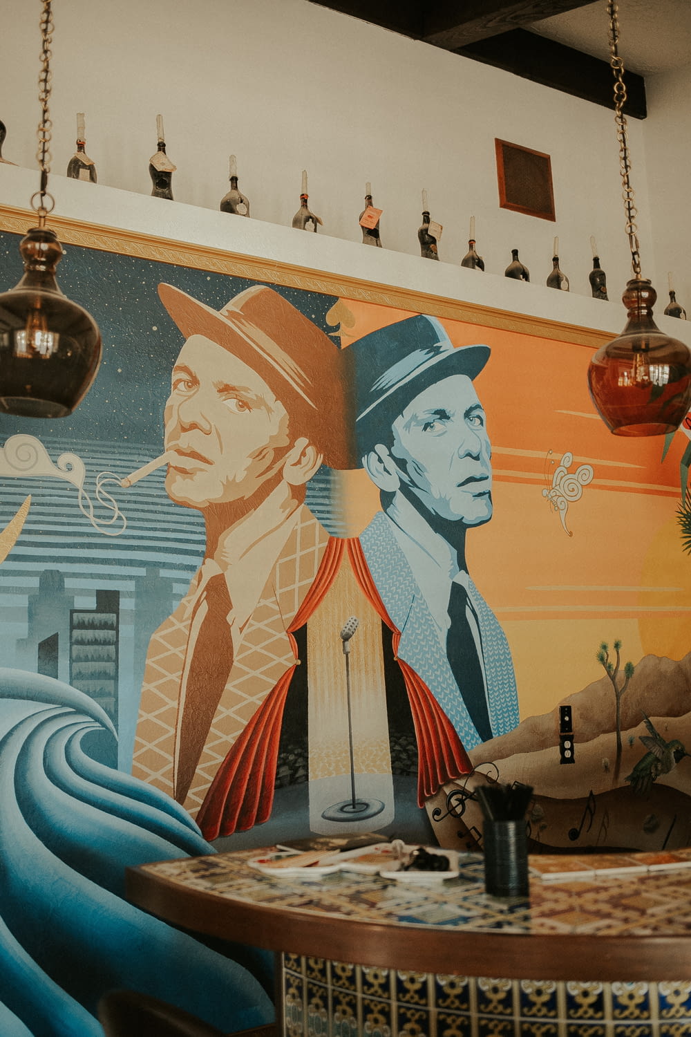 a mural of a man with a hat and tie