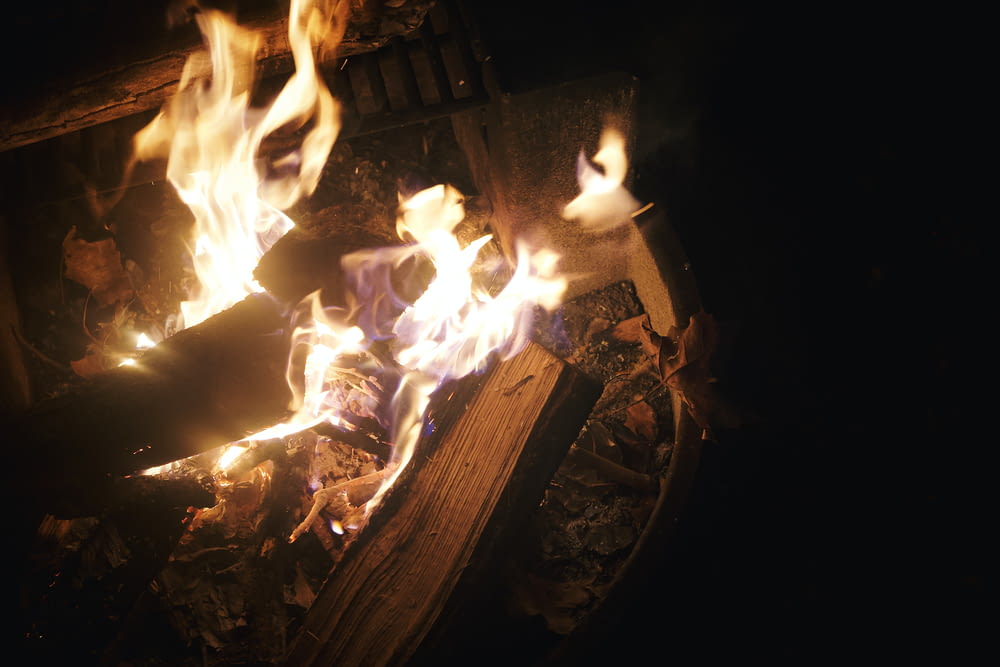 a fire burning in a fireplace with lots of flames