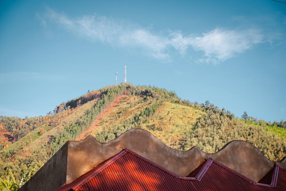 a view of a mountain with a red roof