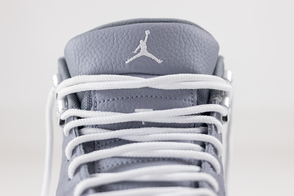 a pair of sneakers with white laces on them