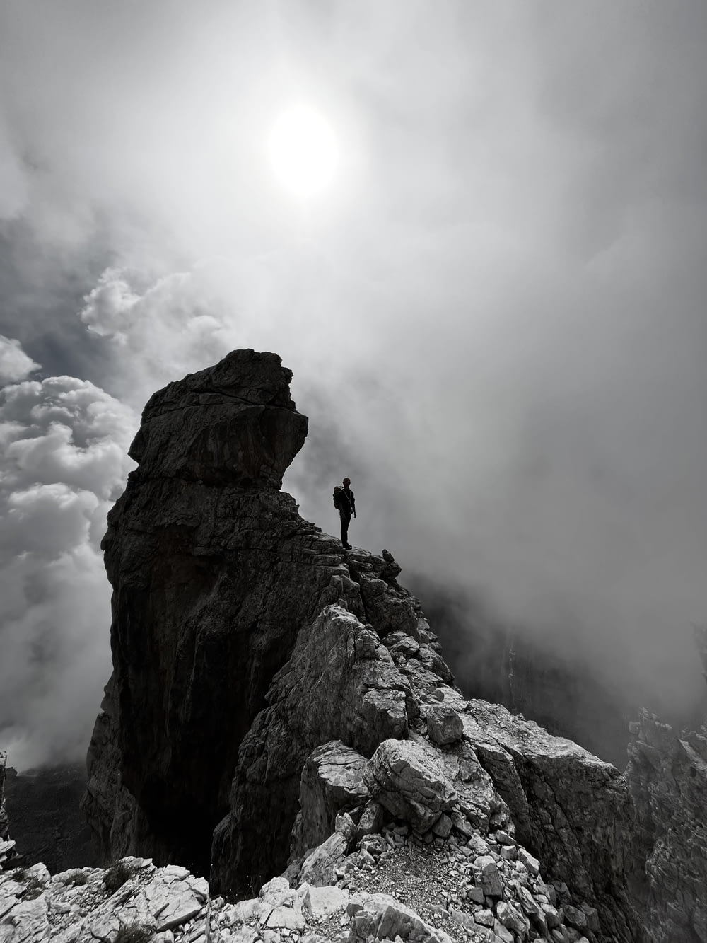 a person standing on top of a rocky mountain