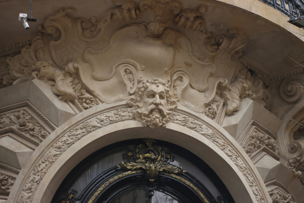 a close up of a doorway with a clock on it