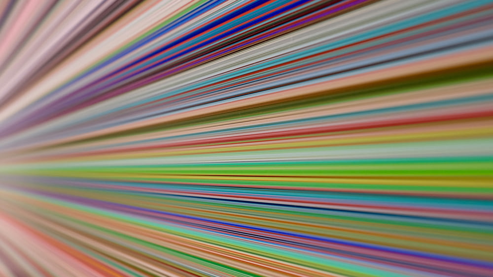 a multicolored image of lines in motion