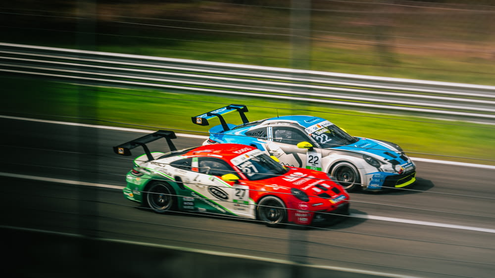 two race cars racing on a race track