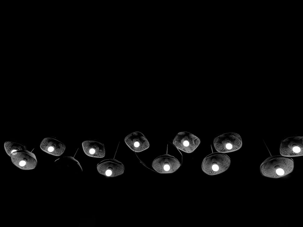 a black and white photo of a bunch of lights