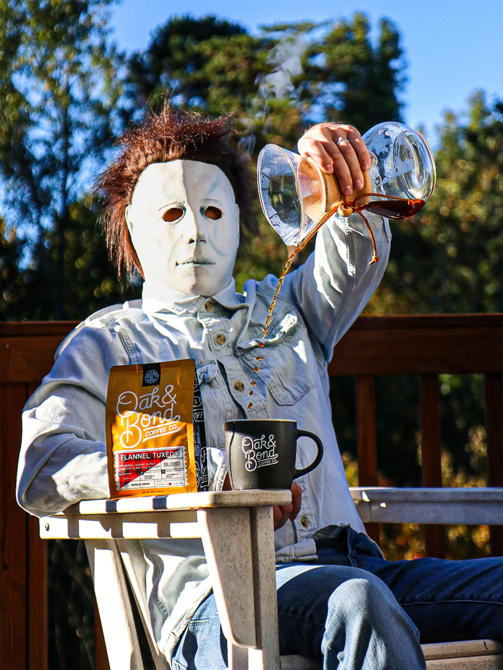 a person wearing a mask drinking from a glass