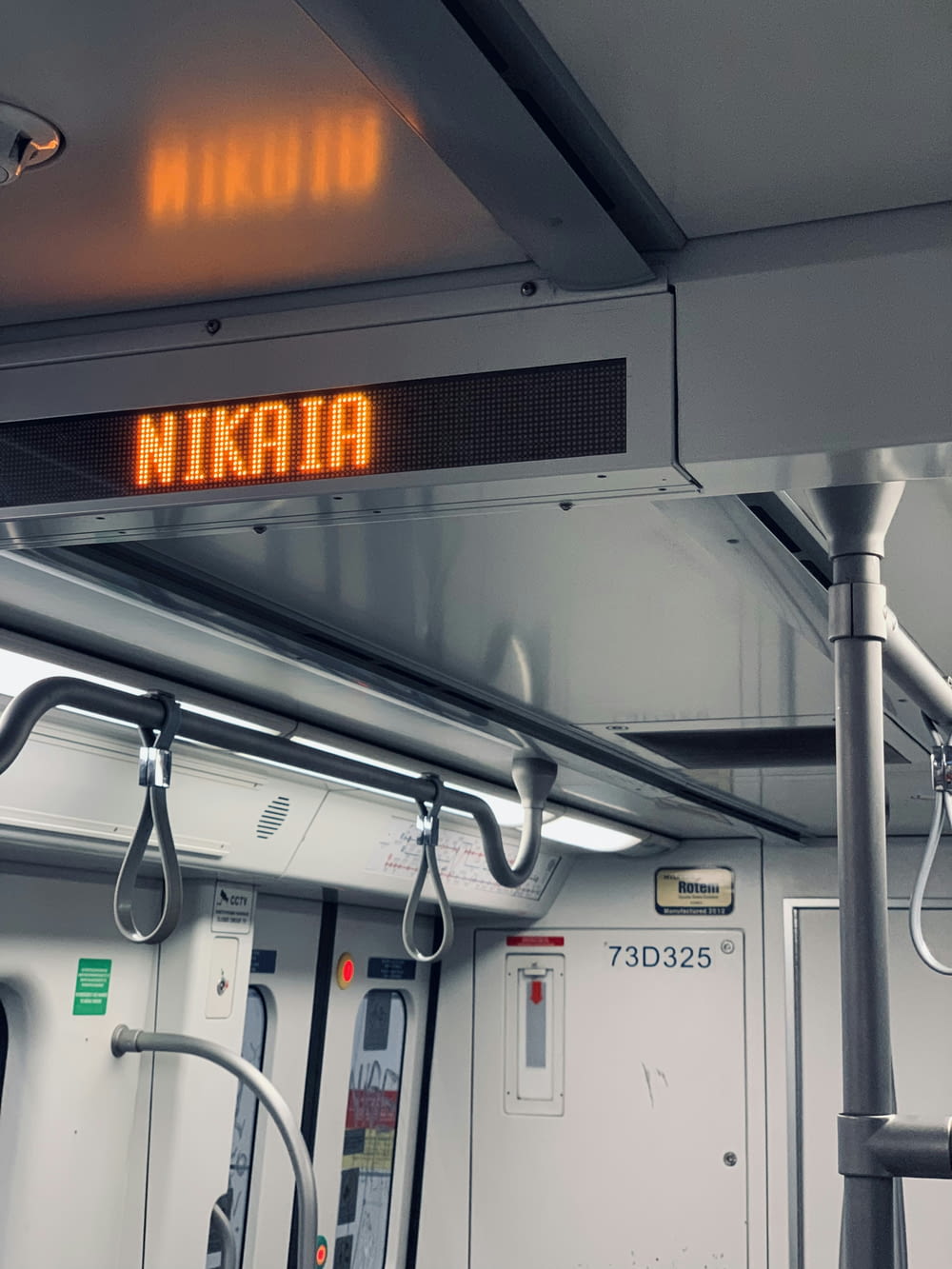 a sign that reads nikata on a train