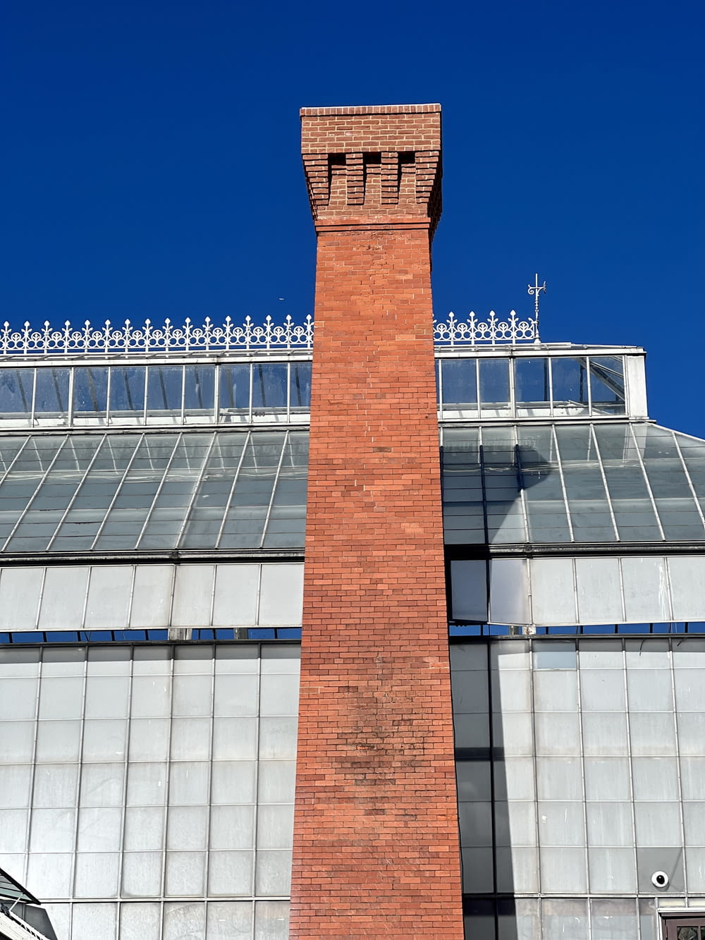 a tall brick tower with a clock on top of it