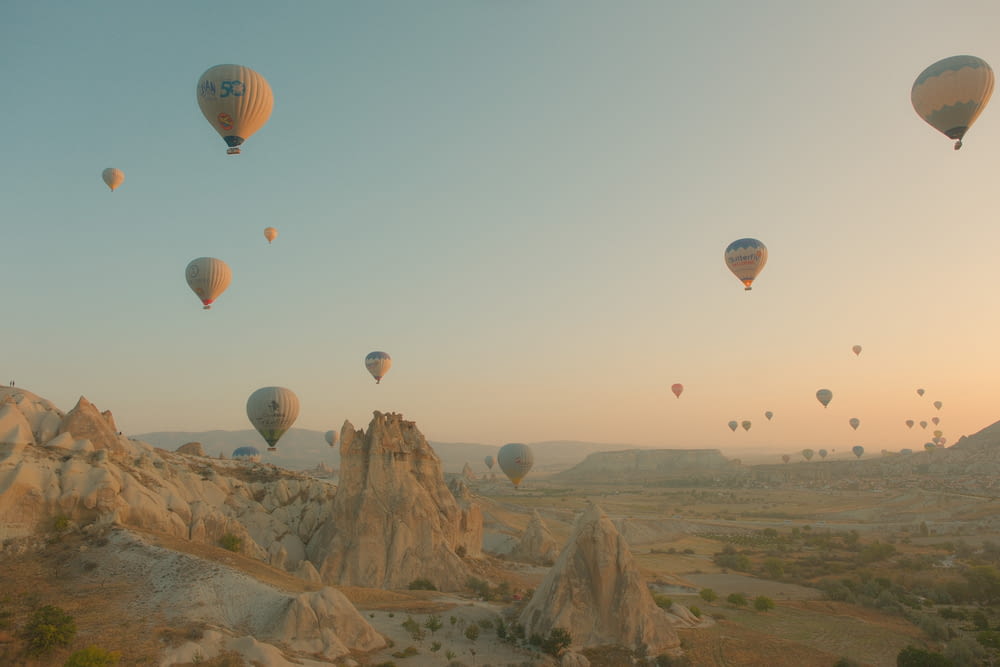 a bunch of hot air balloons flying in the sky