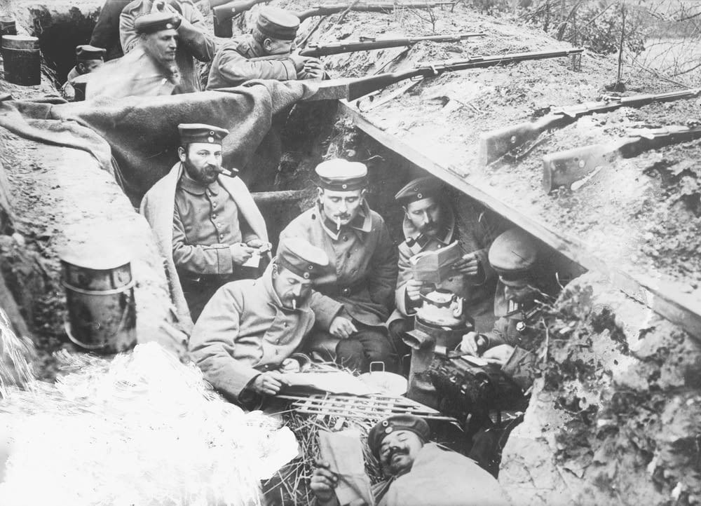 A quiet moment in German trenches. German soldiers smoking and reading in a trench in Flanders, Belgium, during World War I.