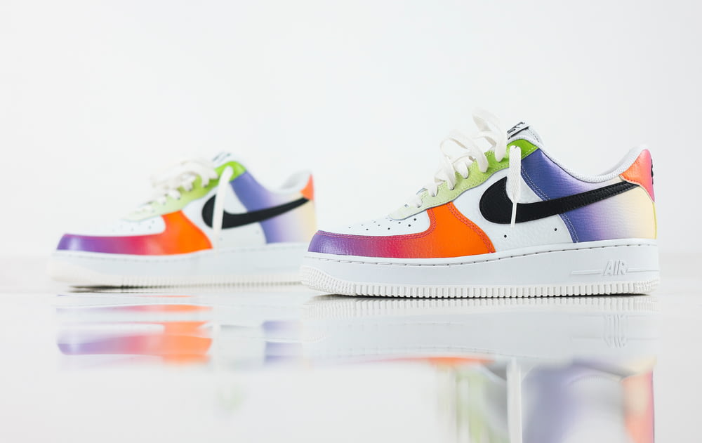 a pair of colorful nike air force sneakers