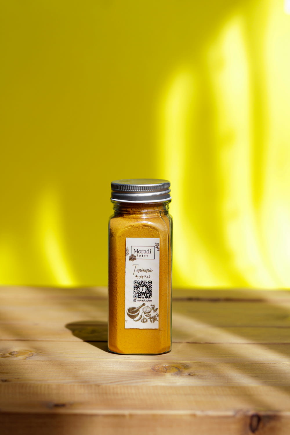 a jar of mustard sitting on top of a wooden table