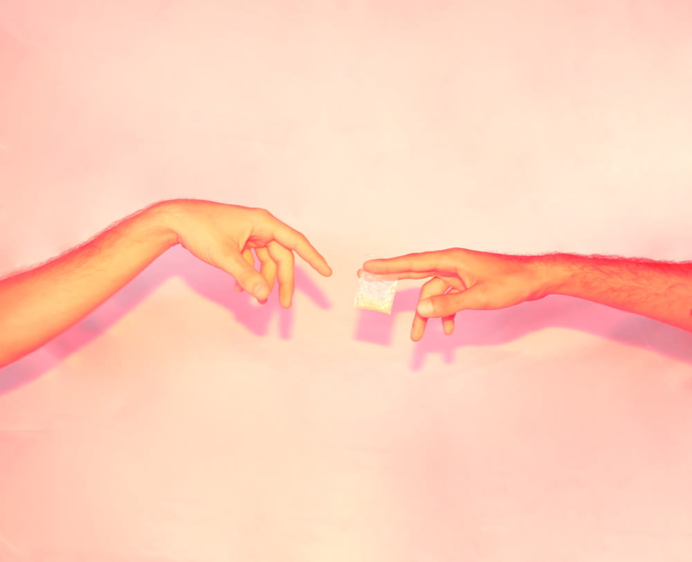 two hands reaching out towards each other