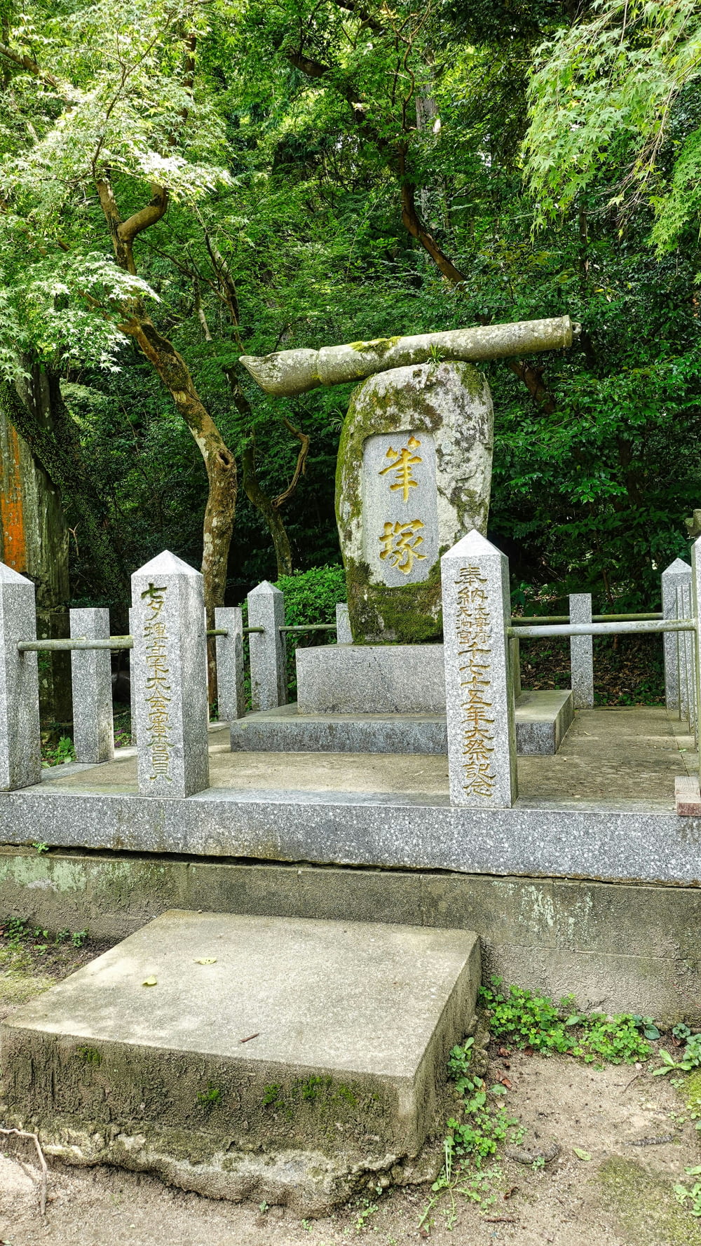 a group of stone statues with writing on them