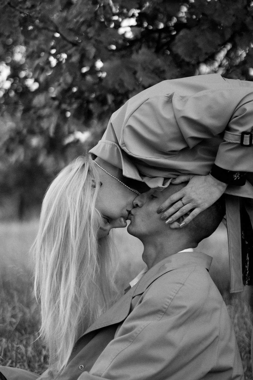 a man kissing a woman on the cheek