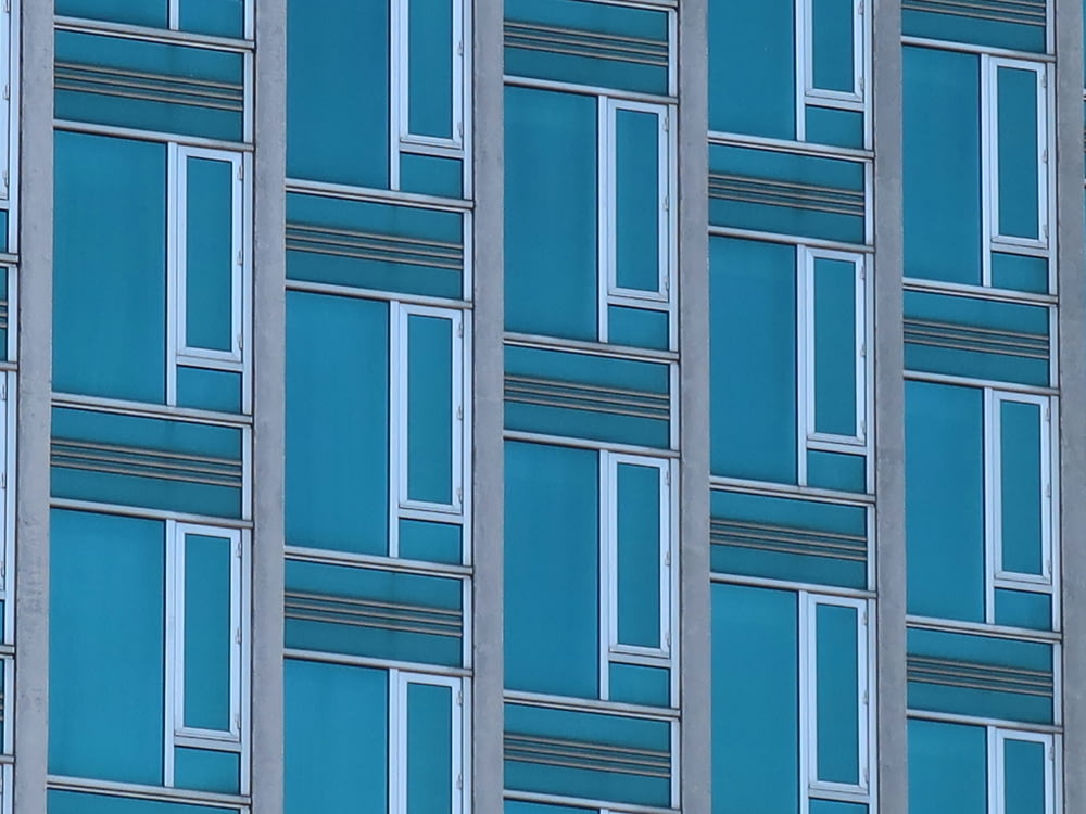 a close up of a very tall building with lots of windows