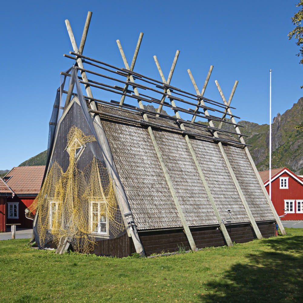 a building with a roof made of sticks