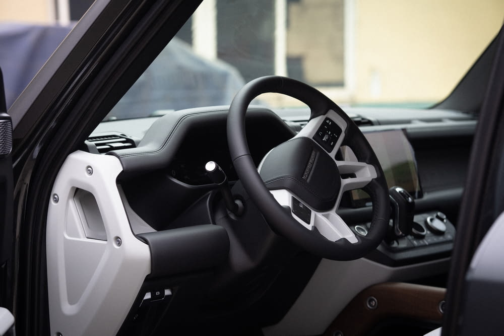 the interior of a vehicle with a steering wheel