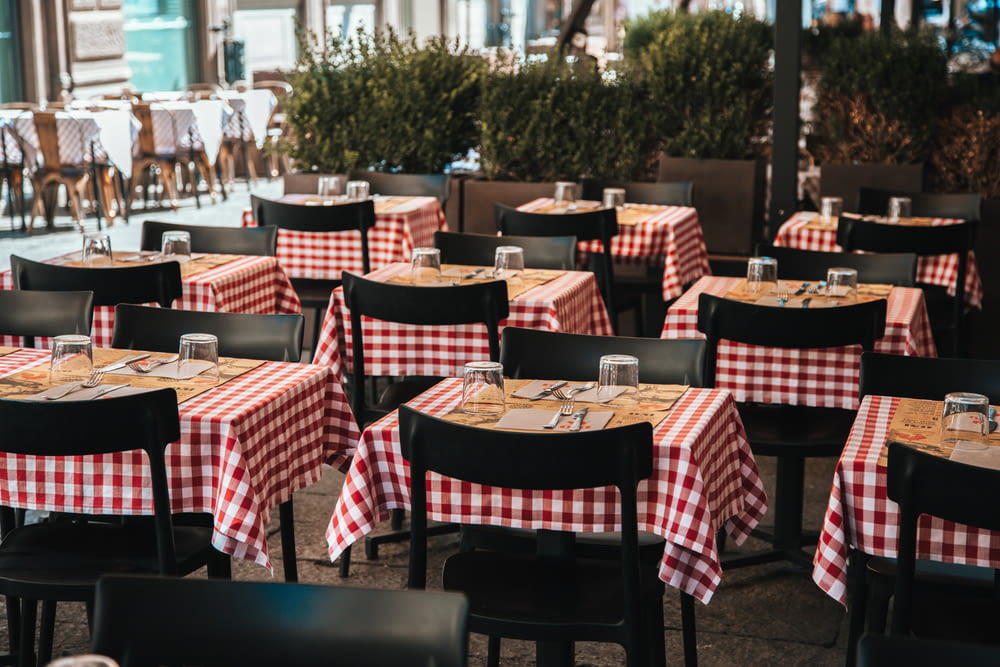 a restaurant with red and white checkered tablecloths