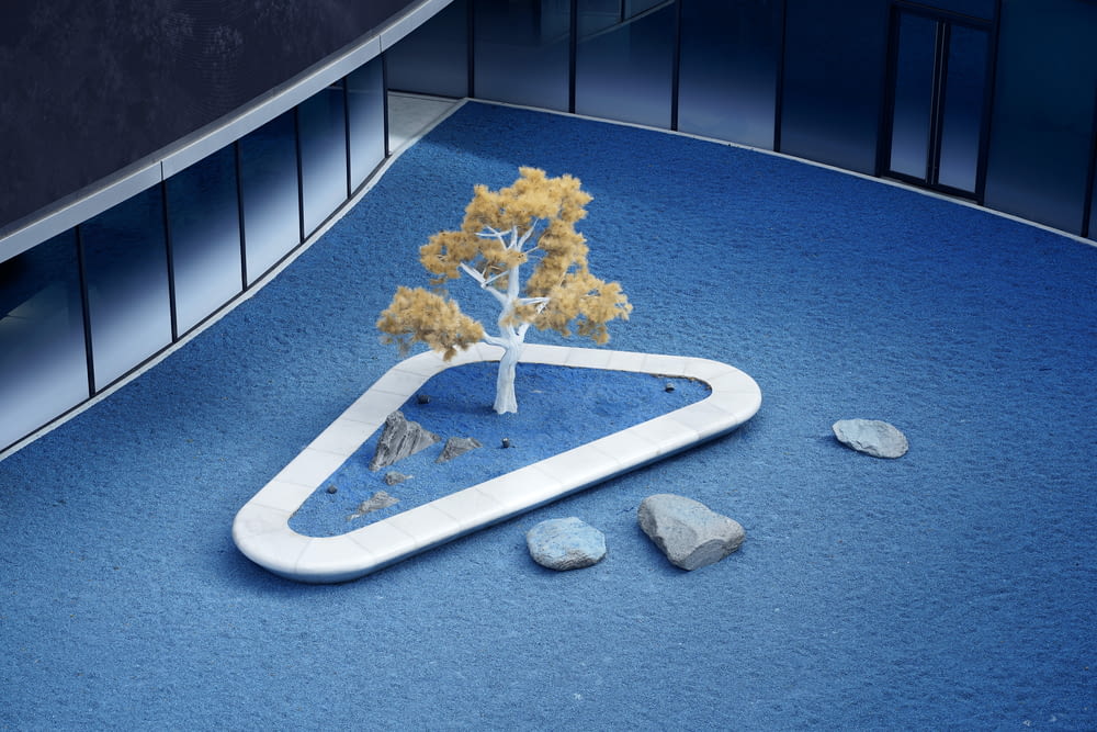 a model of a tree on a blue surface