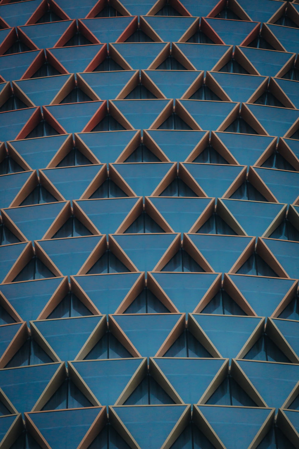 a close up of a building with many triangular shapes