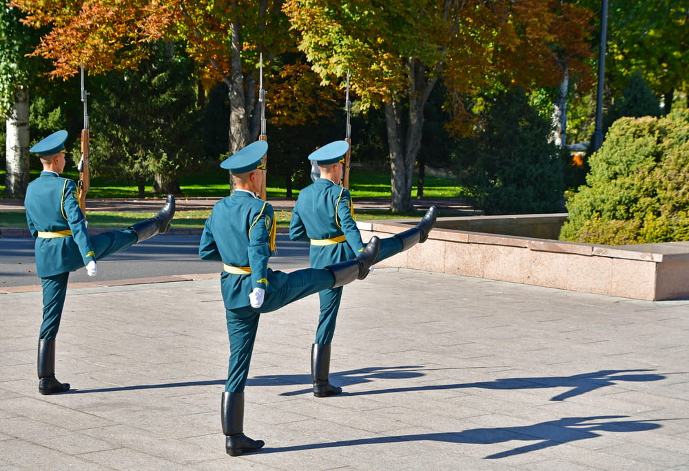 a group of people in uniform standing in a courtyard