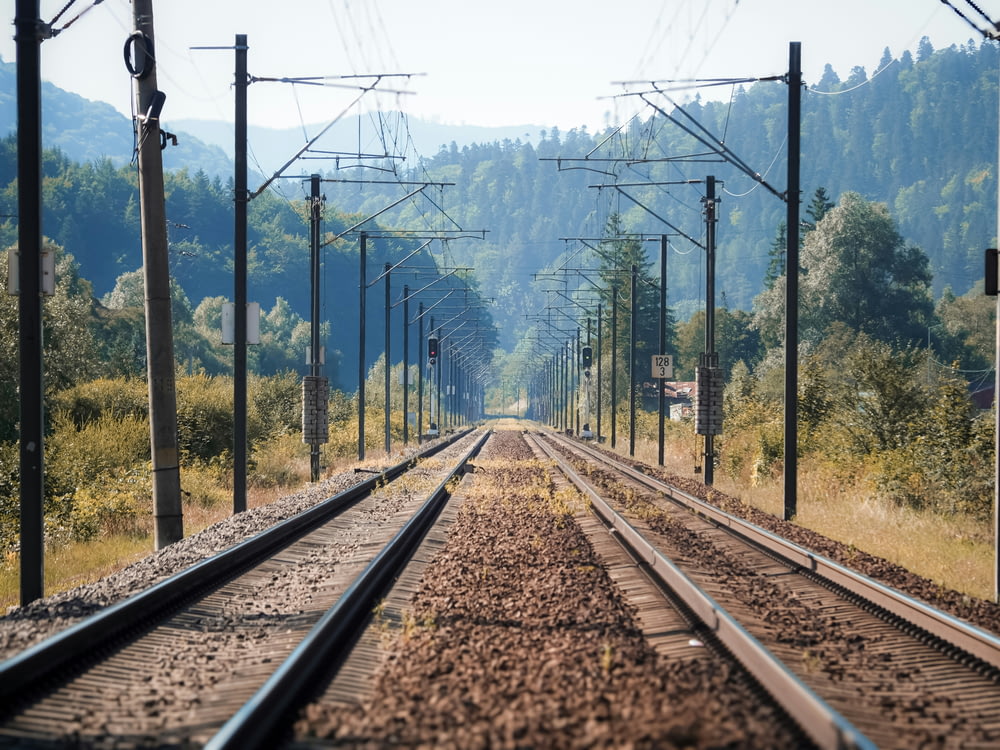 a train track running through a rural countryside