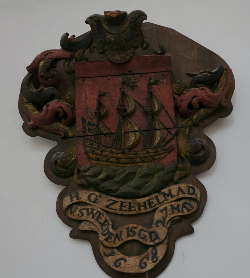 a coat of arms with a ship on it
