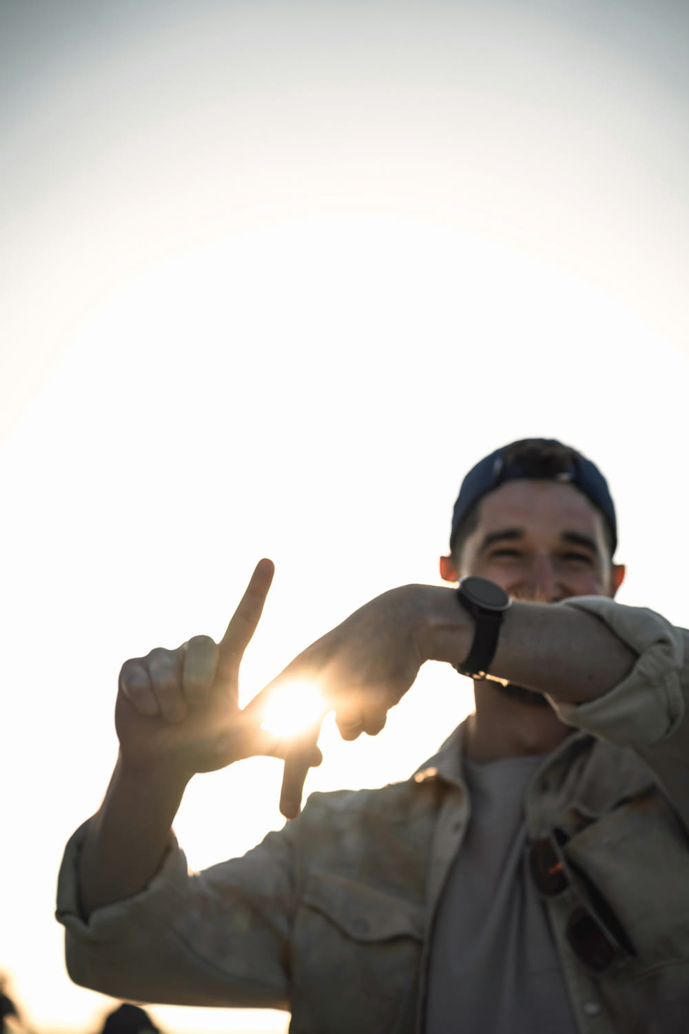 a man making a peace sign with his fingers
