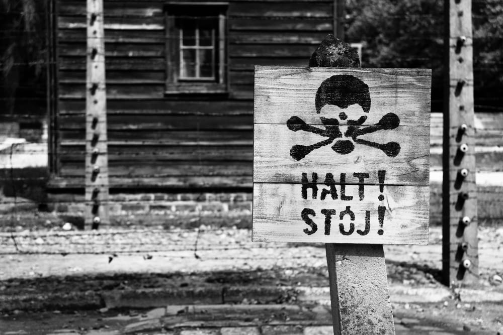 a wooden sign with a skull and crossbones on it