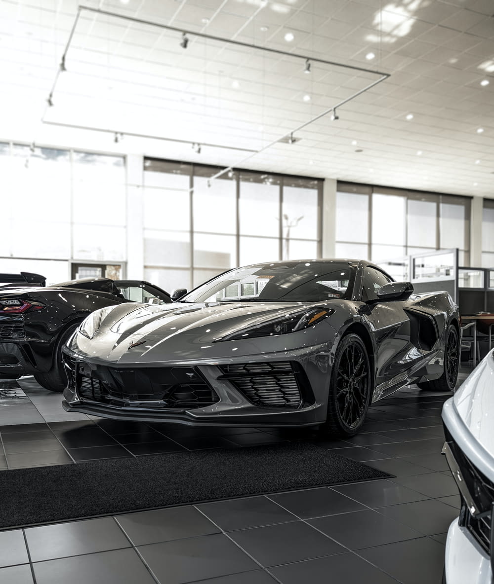 a car showroom filled with all kinds of sports cars