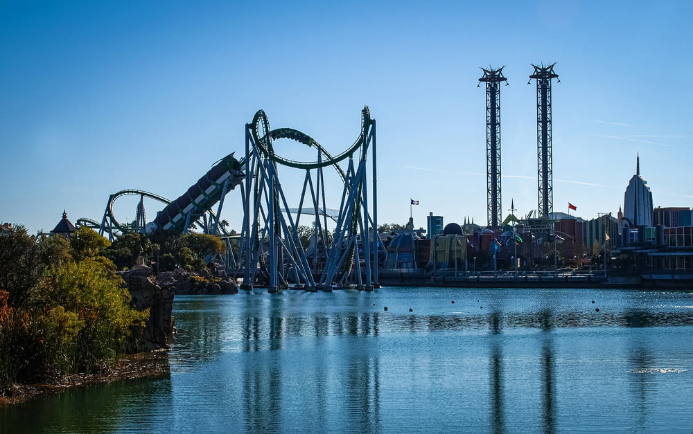 a roller coaster in the middle of a body of water