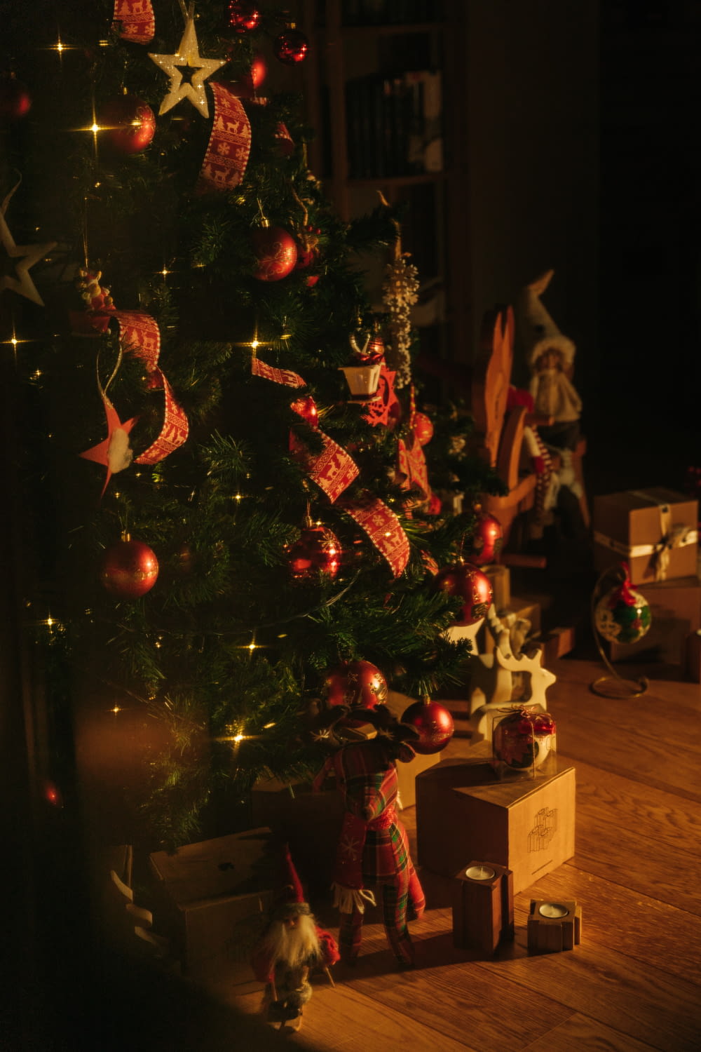 a christmas tree with presents under it