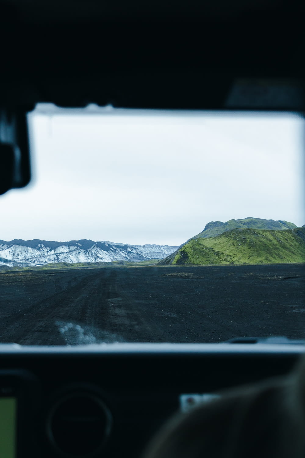 a view from inside a vehicle of a mountain range