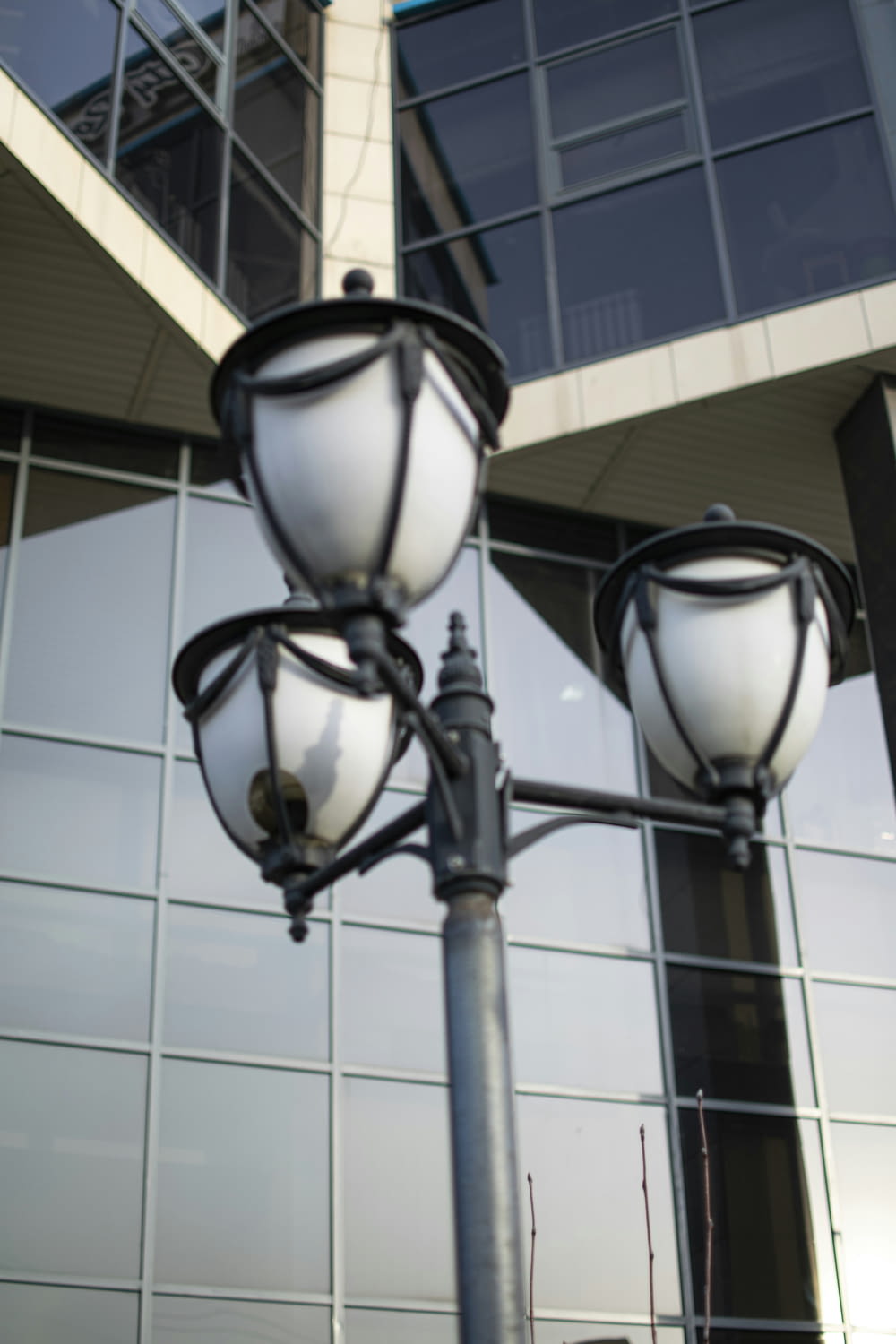 a street light with a building in the background