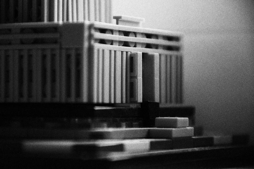 a black and white photo of a model of a building