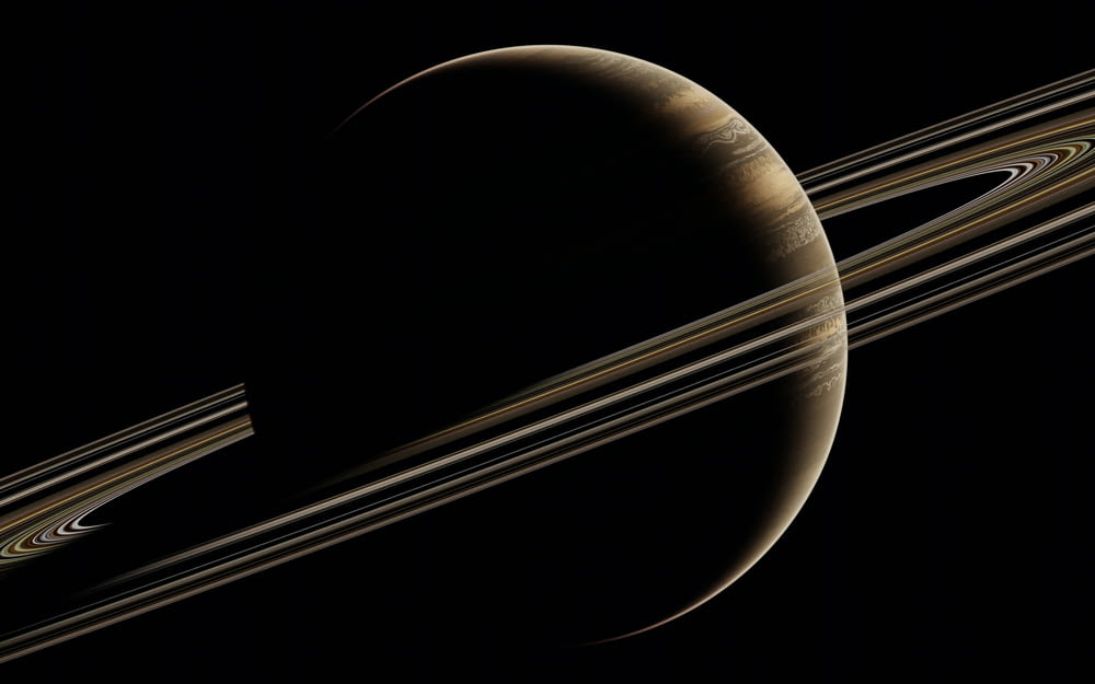 saturn with its rings in the dark sky