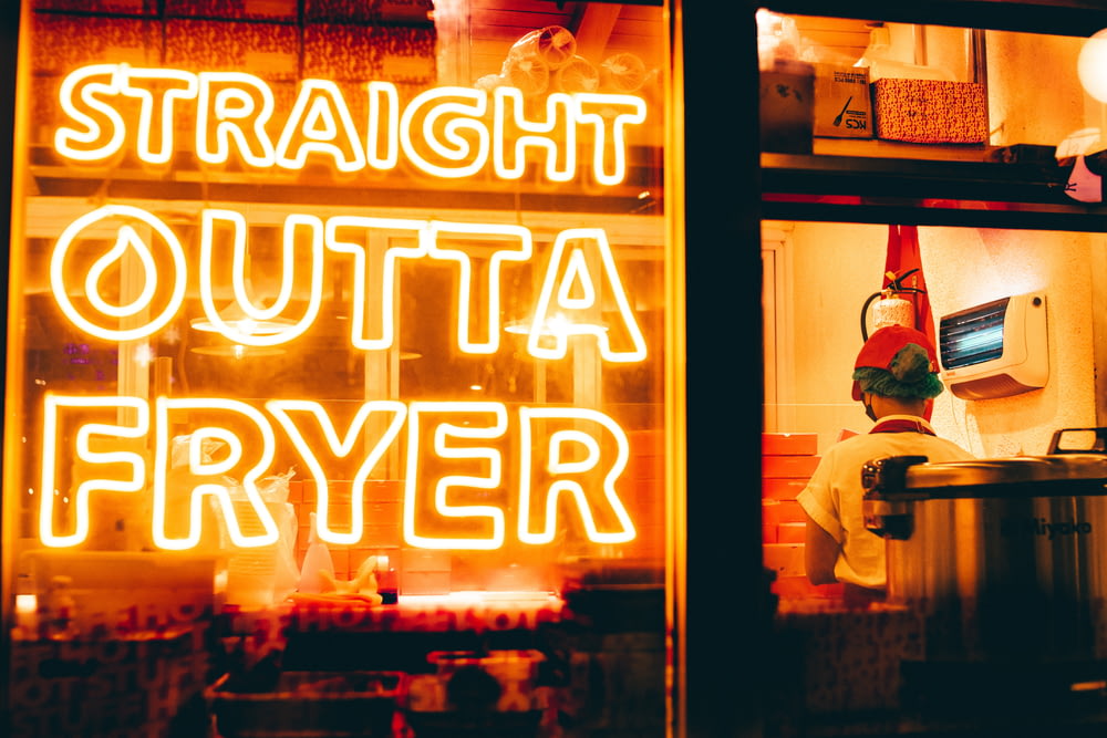 a neon sign that reads straight outa fryer