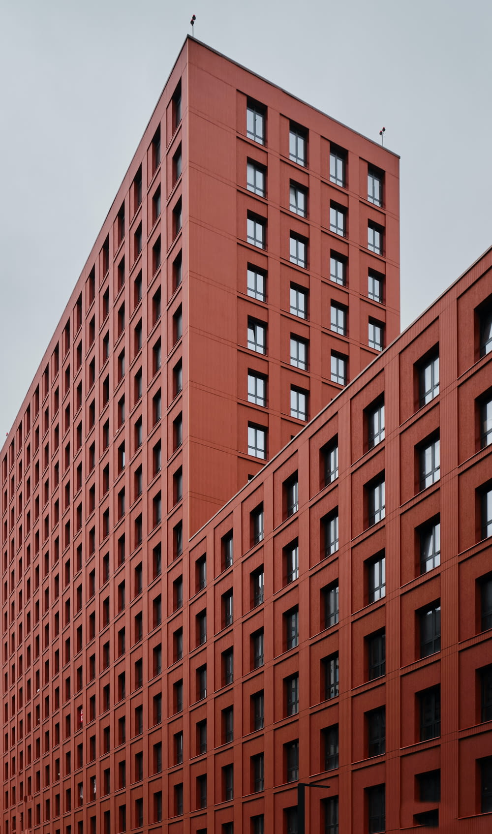 a large red building with many windows on it