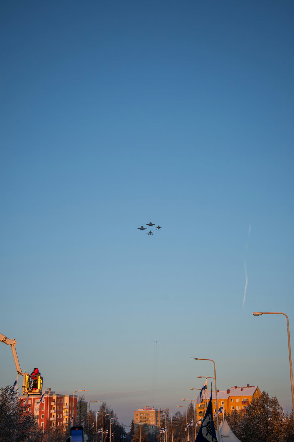 a group of airplanes flying over a city