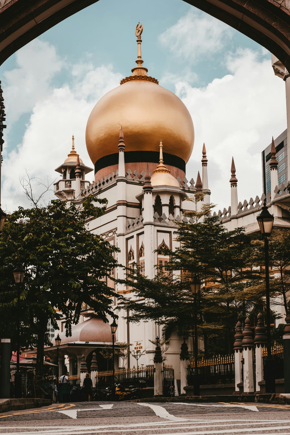 a large white building with a gold dome